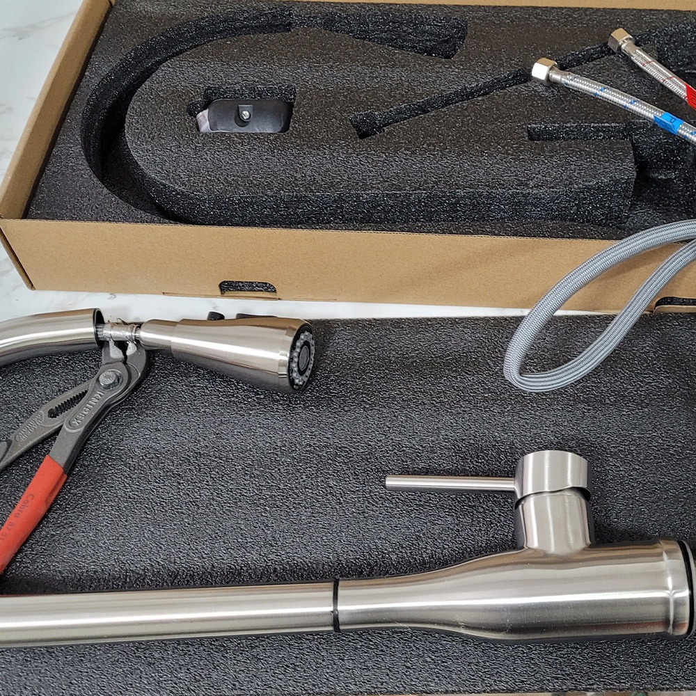 TRUE faucet fittings arranged in protective packaging